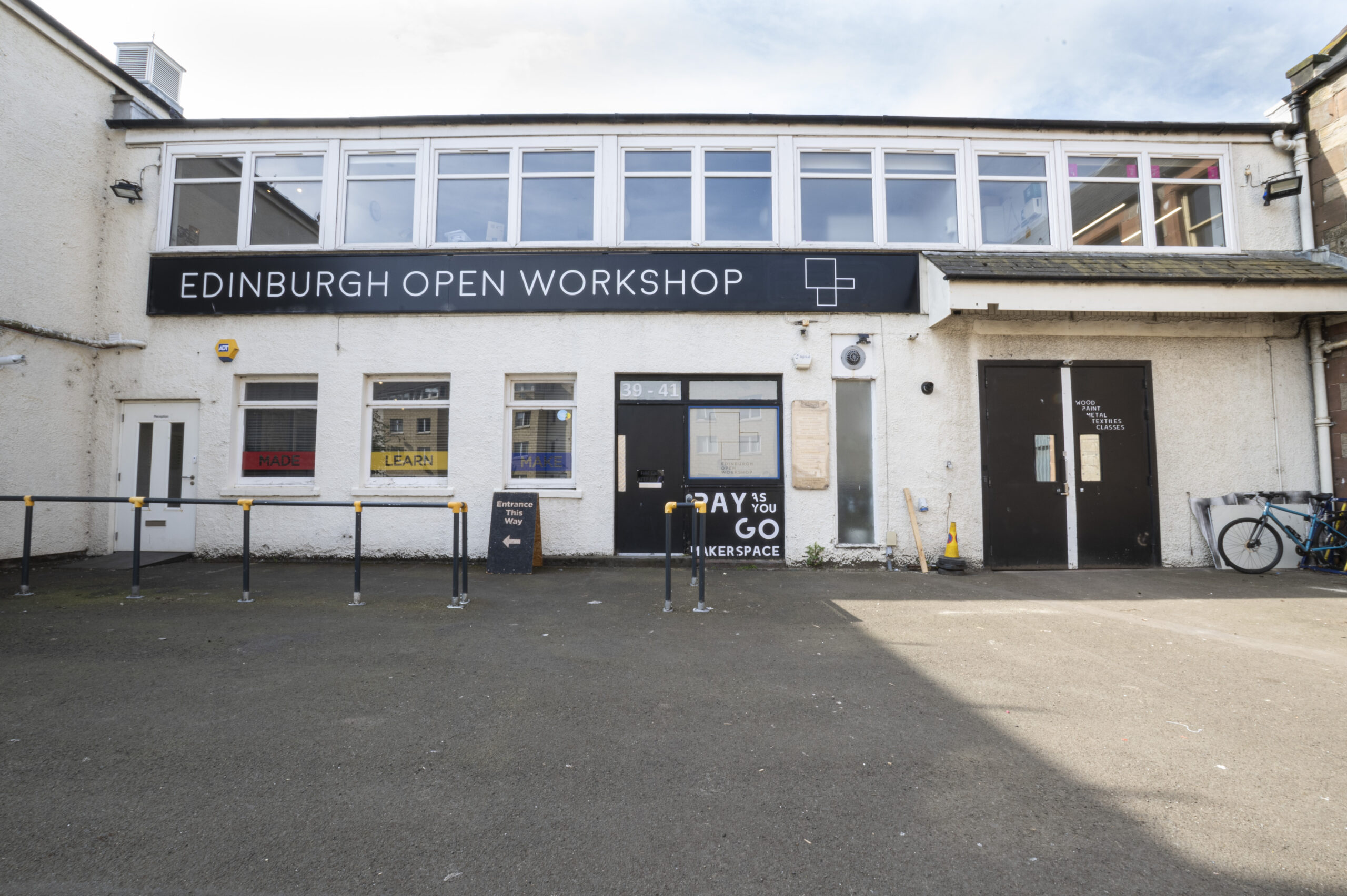 Exterior of Edinburgh Open Workshop in Leith showing front entrance and on-site parking