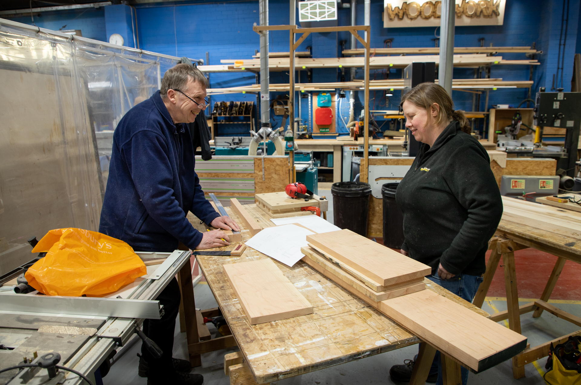 Participants taking part in a woodworking class at EOW