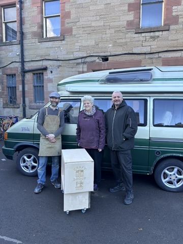 Members of Duncan Place leaving the workshop with their completed sewing table