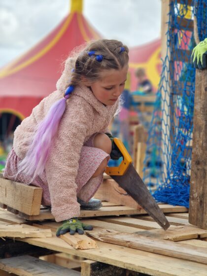 Tinkertown, child with a hand saw 