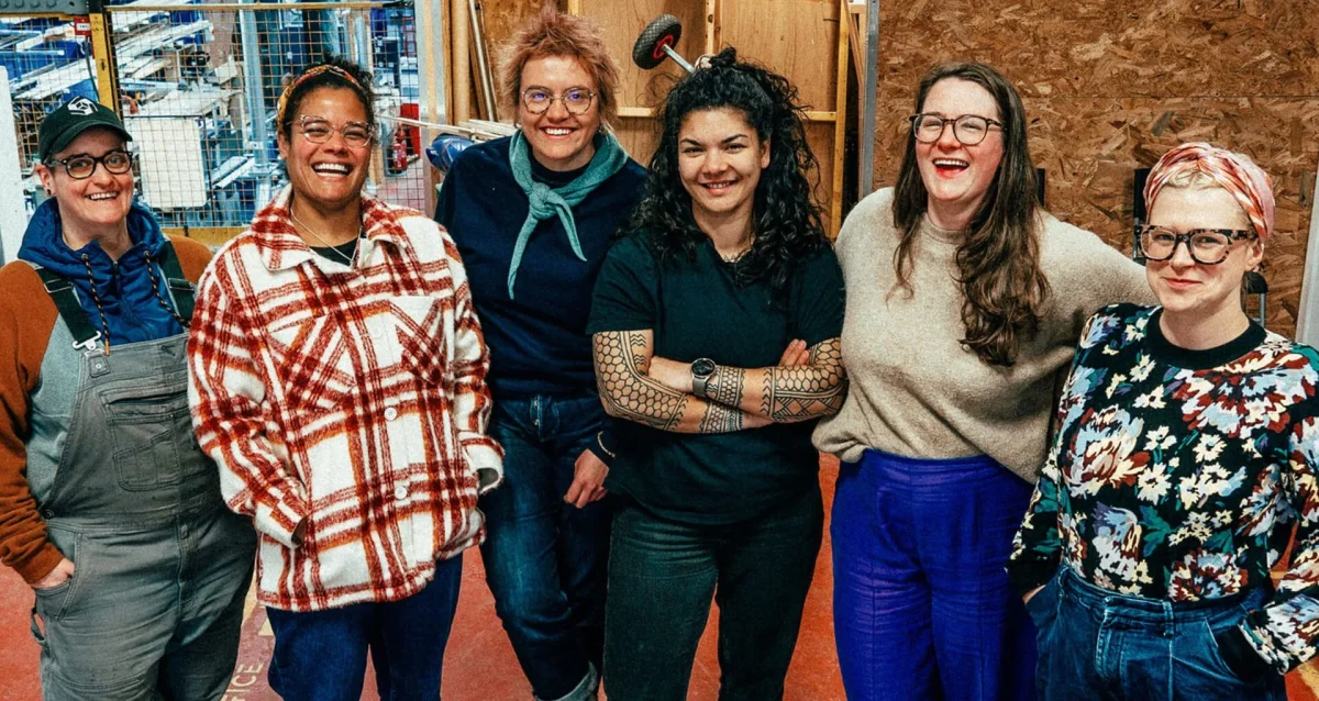 Edinburgh-open-workshop-Master_slide_eow-8-1-e1724794794336 Group of Edinburgh Open Workshop staff laughing and smiling